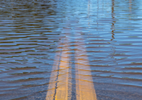 high water level intruding on a road