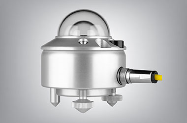 A Kipp & Zonen ISO Class A pyranometer, a small silver instrument with a double glass dome on the top and a yellow cable extending from its side.