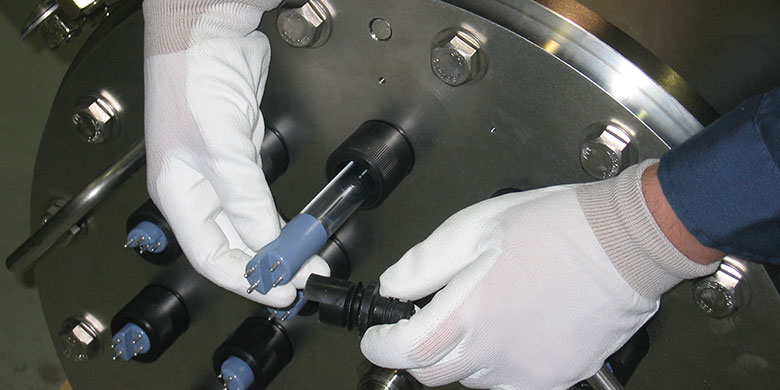 A photo of an operator removing a UV lamp from a TrojanUVSwiftSC chamber
