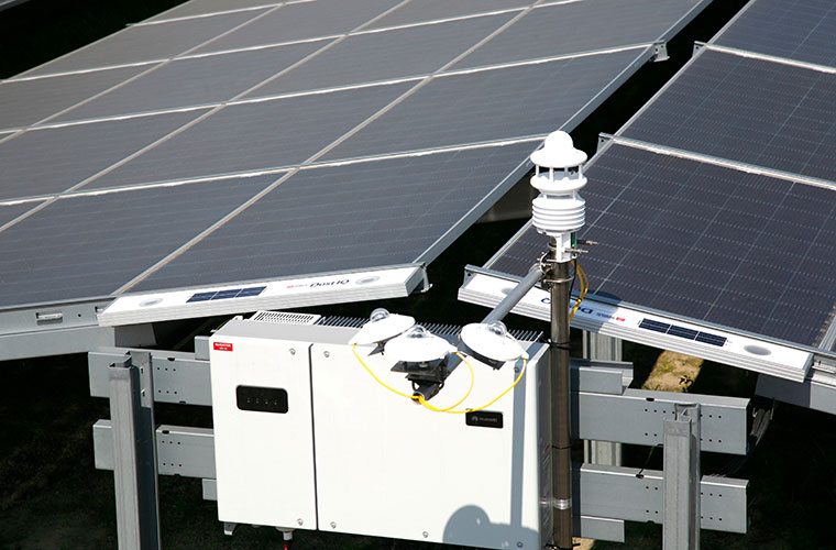 Environmental monitoring station on a PV plant including three Kipp & Zonen pyranometers, two soiling sensors Kipp & Zonen DustIQ, and a Luft WS600 compact weather station
