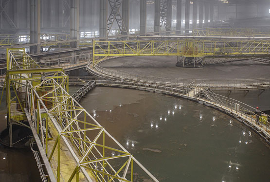 Large industrial water basins in operation within a building.