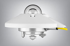 The Kipp & Zonen SMP10 pyranometer instrument showing a white sun shield, a double glass dome, and a yellow cable extending from the side.