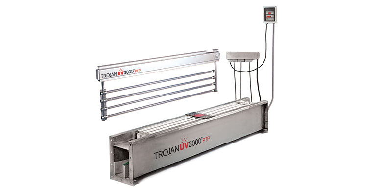 A photo of the TrojanUV3000PTP system with a module lifted out of a stainless-steel channel