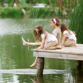 Kids playing by a lake