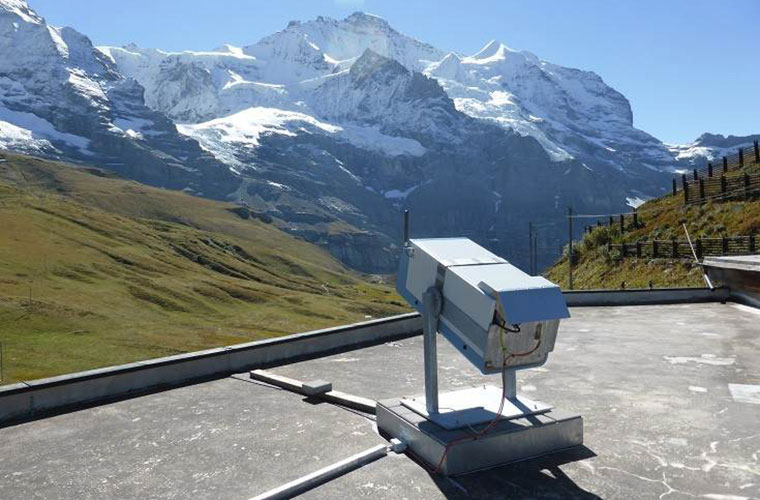 Ceilometer Lufft CHM 15k in front of snow-covered mountains